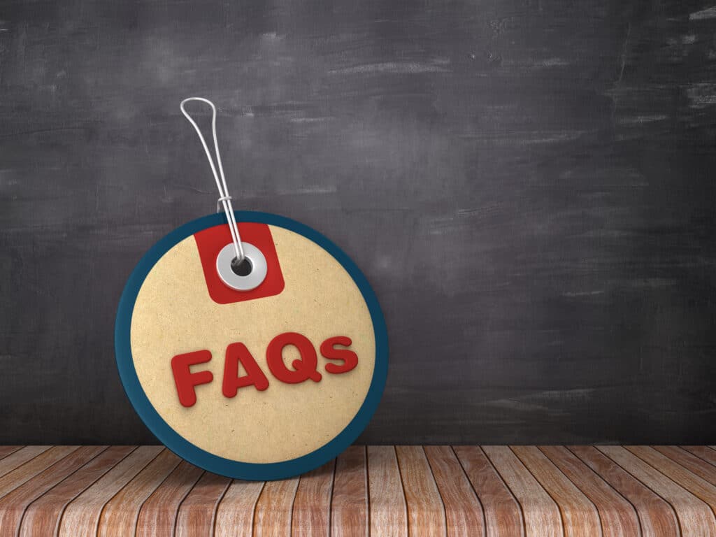 FAQs circular price tag on chalkboard background.