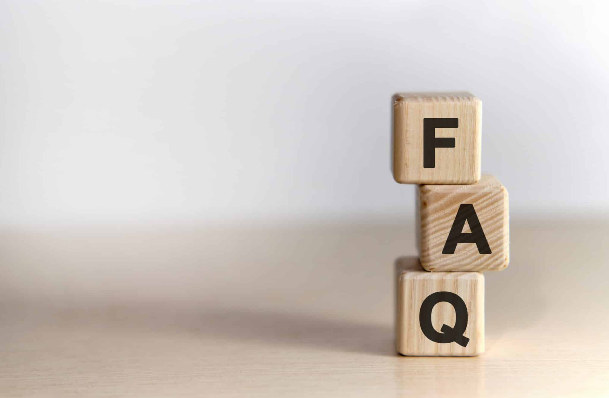 Balanced Air FAQ - text on wooden cubes, on wooden background.