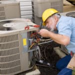 Man Working on AC Repair.